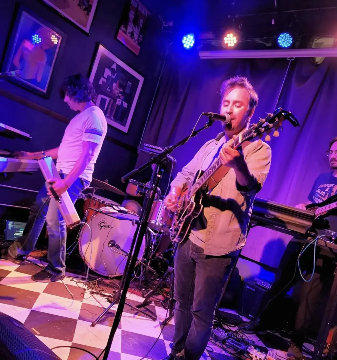 Estate Sale playing live in Chicago under purple light