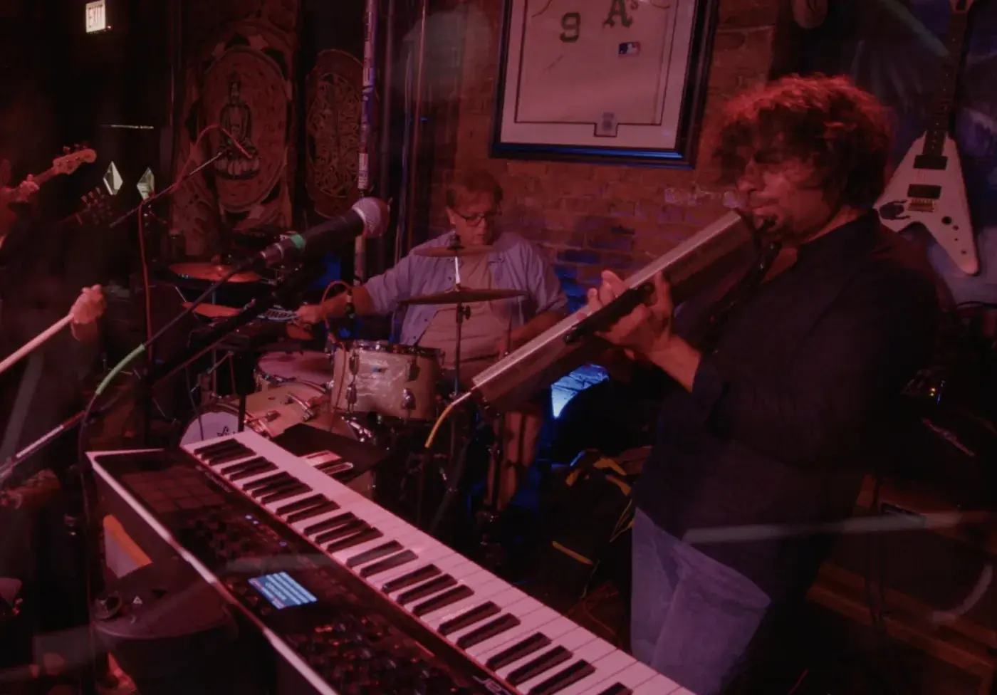 Keys and drums under red light