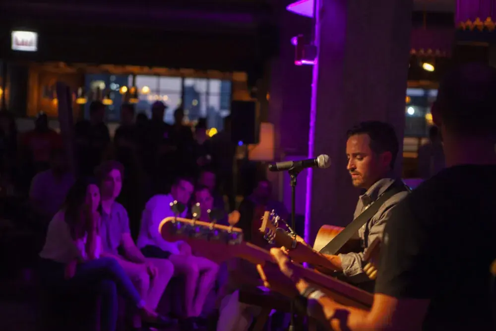 Guitarist in purple light at Soho House Chicago